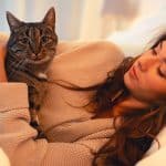 woman on the bed with cat