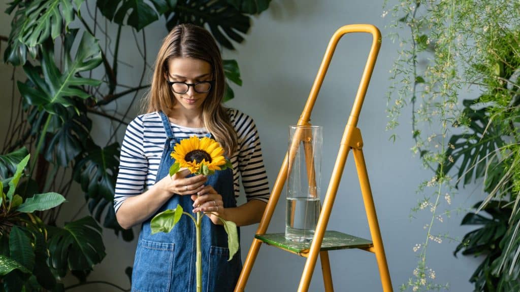 Woman holding sunflower